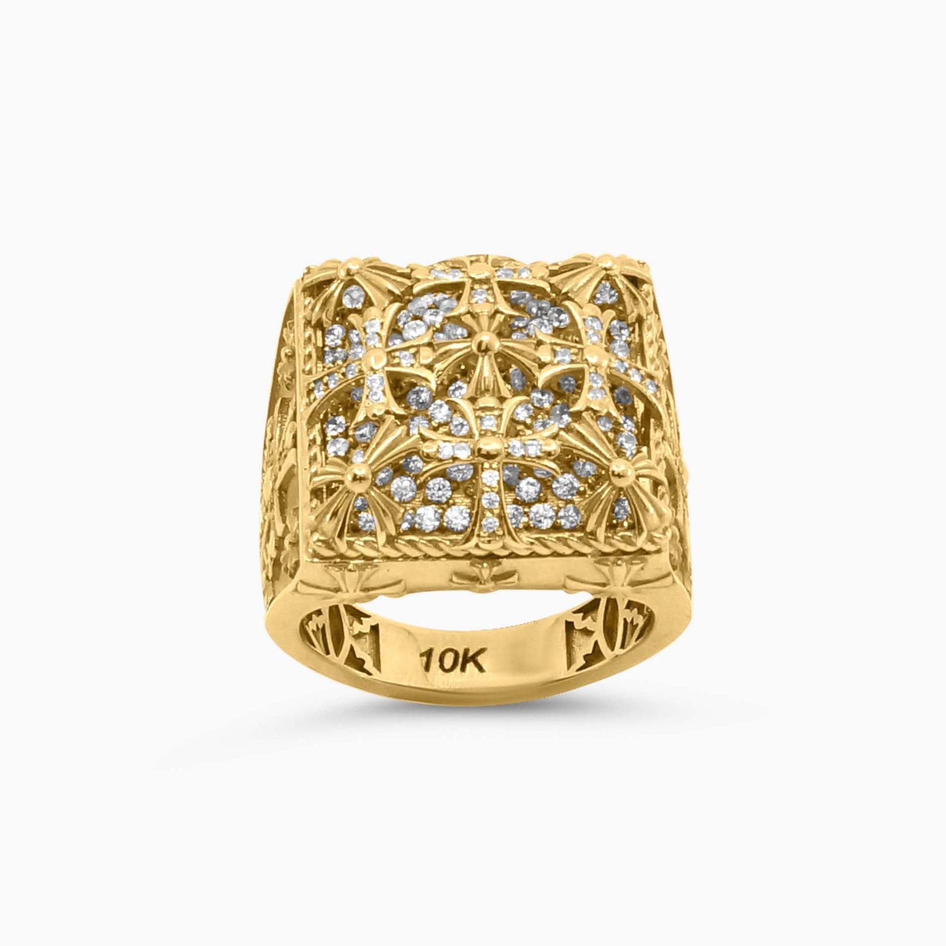 Gold ring with intricate design on a white background